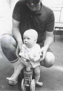 Bob Anderton Seattle bike lawyer pictured as a young baby on his first wheeled thingy bike.